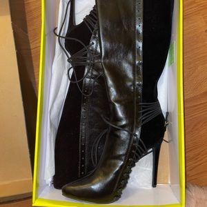 Knee-high black heeled boots size 6.5